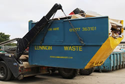 Skip Hire in Ongar full skip being unloaded